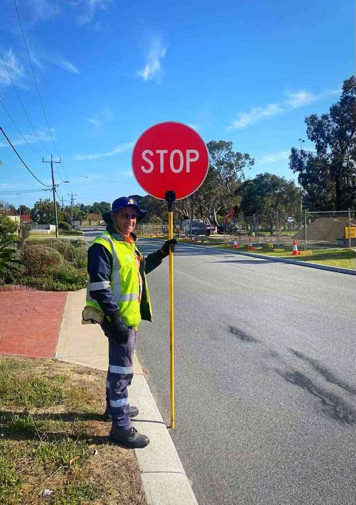 Traffic Controller holding a Stop sign